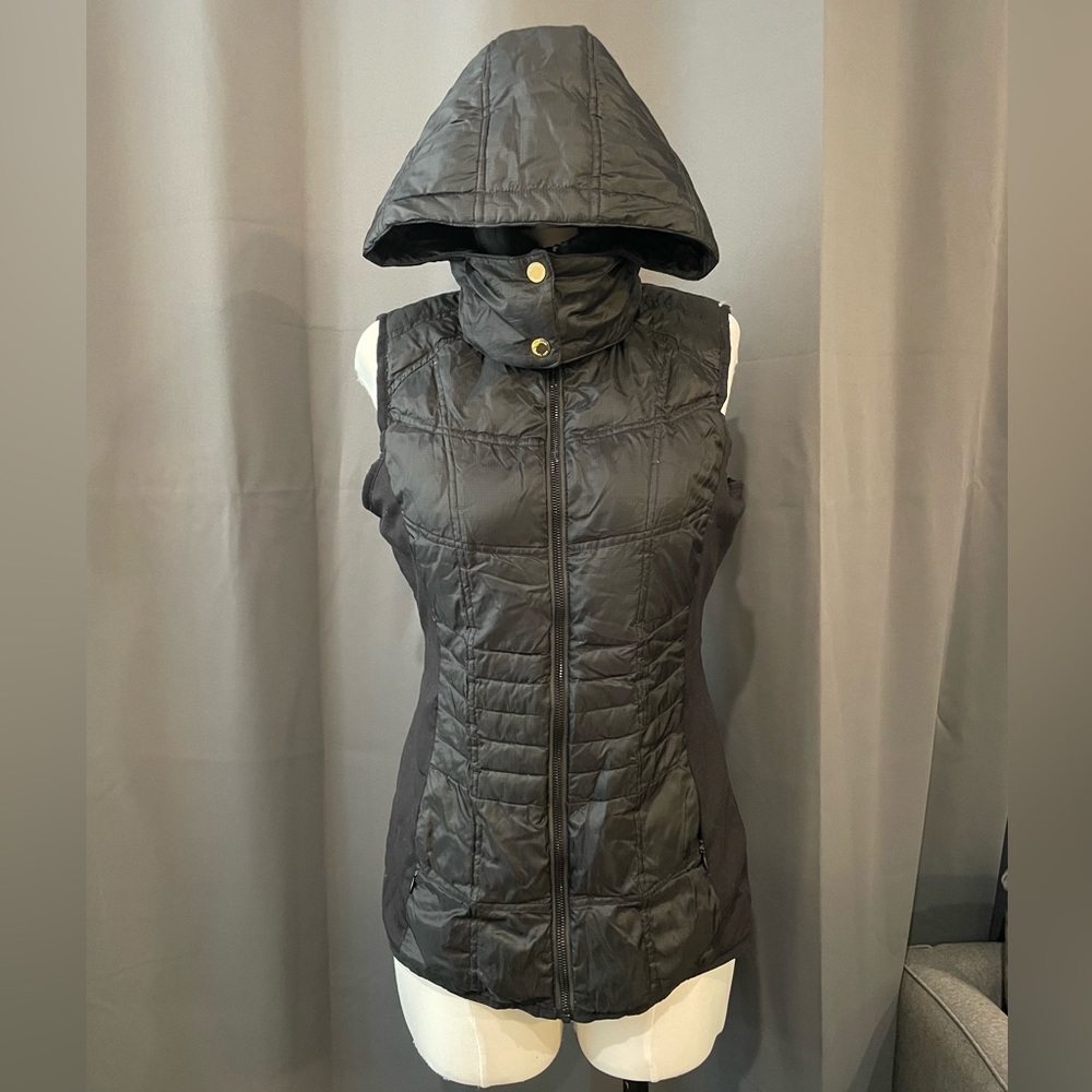 Michael Kors zip up puffy vest with detachable hood in black and gold hardware.